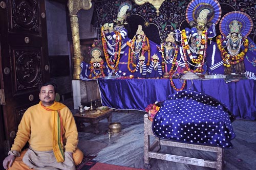 Hindu priest with statues of Krishna and Gopis, Vrindavan