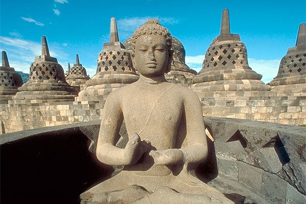 Buddha statue on the upper terrace of Borobudur Stupa, Java, Indonesia