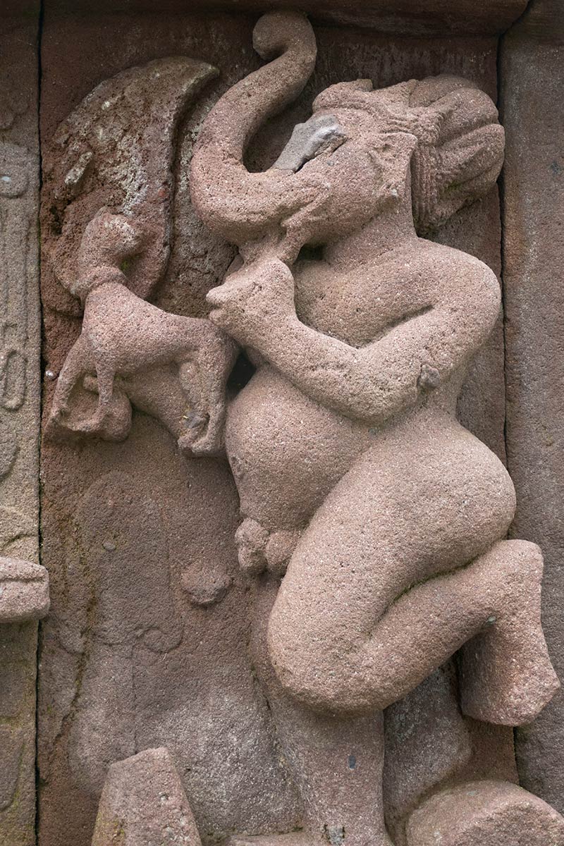 Stone sculpture of Ganesh at metal forge, Candi Sukuh